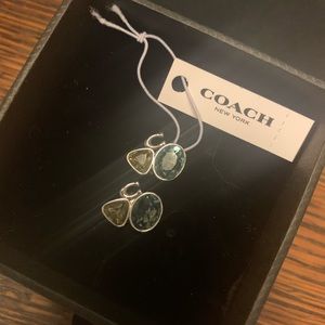 Coach signature cluster crystal earrings In silver with blue and purple stones